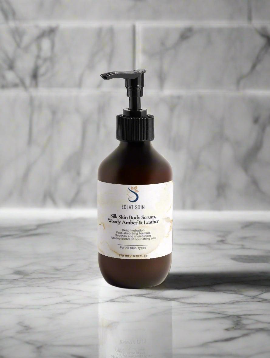 Eclat Soin Silk Skin Body Serum in a pump bottle for moisturizing with Woody Amber & Leather scent